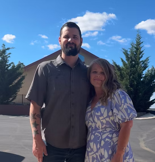 couple standing and smiling
