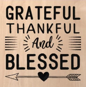 wood sign that says "grateful thankful and blessed"