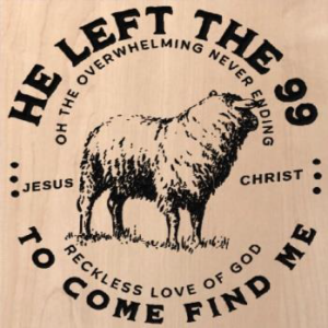 wood sign that says "He left the 99 to come find me. Oh the overwhelming never ending reckless love of God. Jesus Christ." With a sheep in the middle of the text