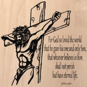wood sign with Jesus hanging on the cross and text next to it that says "For God so loved the world that he gave his one and only Son, that whoever believes in him shall not perish but have eternal life. John 3:16"