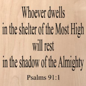 wood sign that says "whoever dwells in the shelter of the Most High will rest in the shadow of the Almighty -Psalms 91:1"