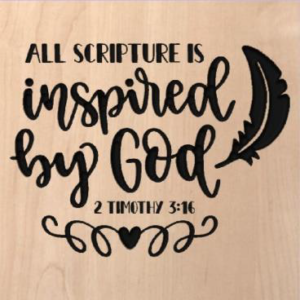 wood sign that says "all scripture is inspired by God -2 Timothy 3:16"
