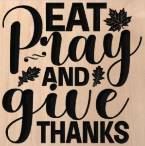 wood sign that says "eat pray and give thanks"