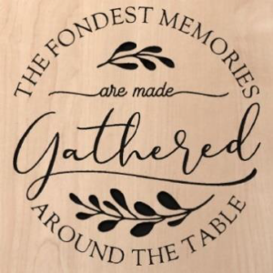 wood sign that says "the fondest memories are made gathered around the table"