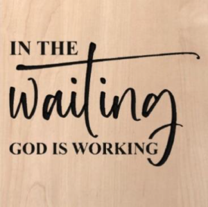 wood sign that says "in the waiting God is working"
