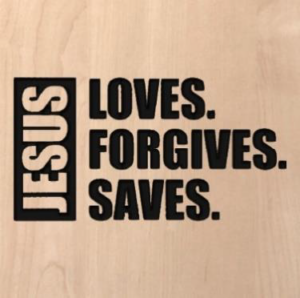 wood sign that says "Jesus loves. forgives. saves."