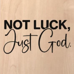 wood sign that says "not luck, just God"