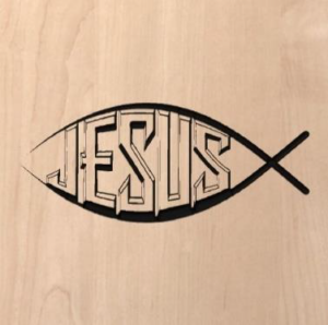 wood sign with "Jesus" written inside a fish shape