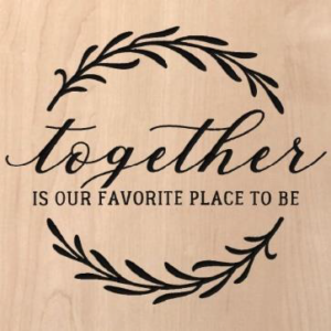 wood sign that says "together is our favorite place to be" and has vines in a circle around it