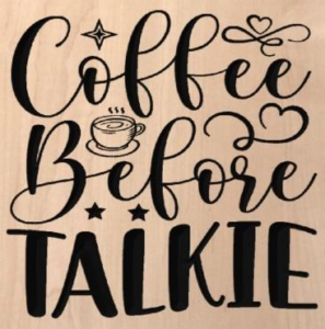 wood sign that says "coffee before talkie" with a coffee cup