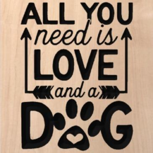 wood sign that says "all you need is love and a dog"