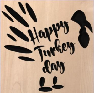 wood sign that says "happy turkey day" in the shape of a turkey