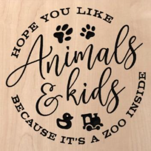 wood sign that says "hope you like animals & kids because it's a zoo inside"