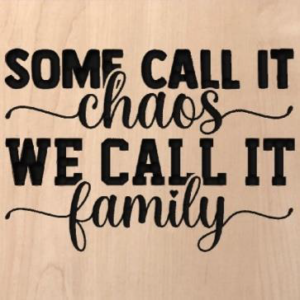 wood sign that says "some call it chaos we call it family"