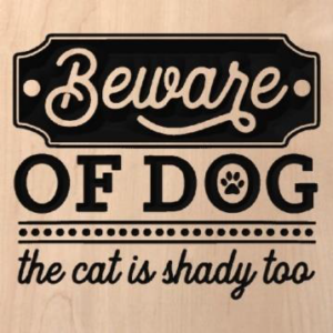 wood sign that says "beware of dog, the cat is shady too"