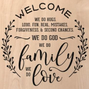 wood sign that says "welcome we do hugs. Loud. Fun. Real. Mistakes. Forgiveness. & second chances. We do God We do family We do love"
