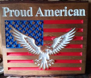 Proud american wood sign with american flag and eagle below the text