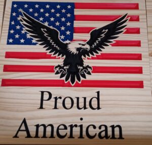 Proud american wood sign with american flag and eagle above the text