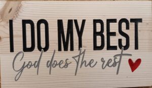 wood sign that says "I do my best God does the rest" with a red heart after and black and grey text.
